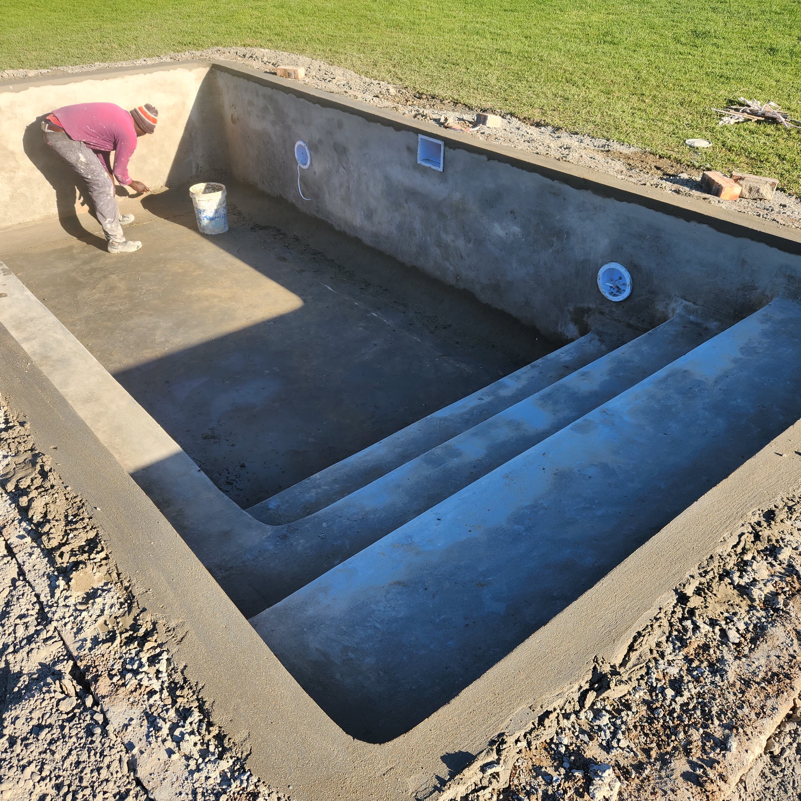 A swimming pool shell plastered, with the steps formed